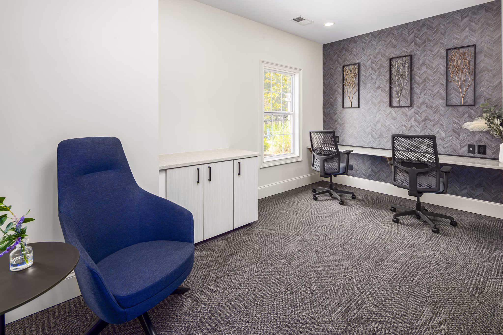 Fully-equipped business center at Ashton Brook Apartments featuring workstations and meeting areas