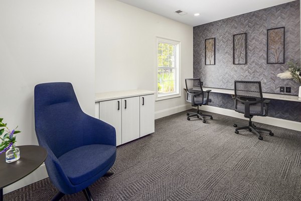 Fully-equipped business center at Ashton Brook Apartments featuring workstations and meeting areas