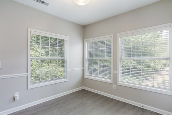 Dining room with elegant decor and modern furnishings at Ashton Brook Apartments luxury community