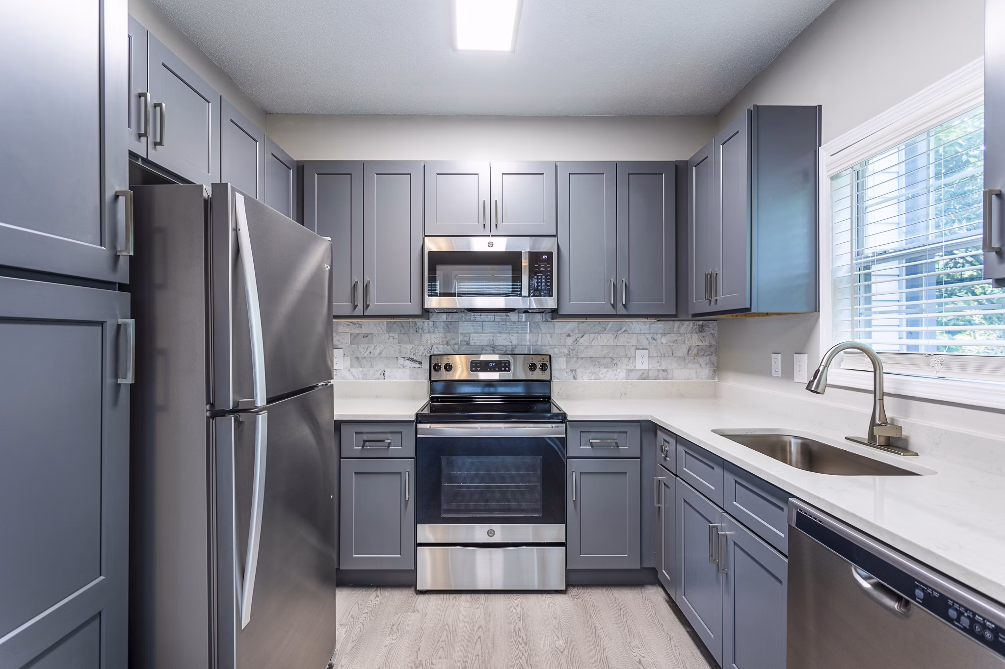 Ashton Brook Apartments: Modern kitchen with stainless steel appliances and granite countertops