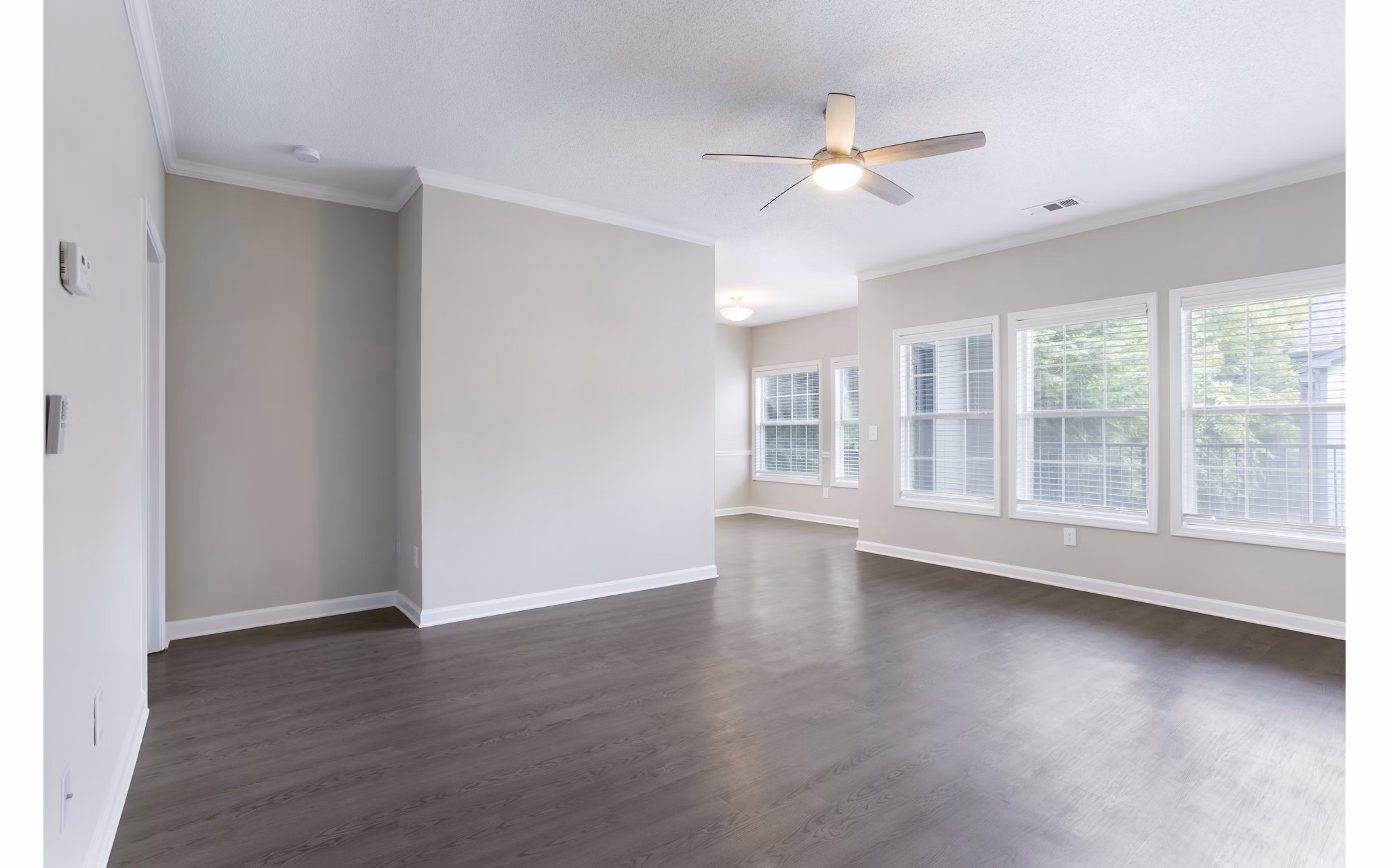Living room at Ashton Brook Apartments: Cozy interior with modern furnishings and ample natural light in luxury Greystar property