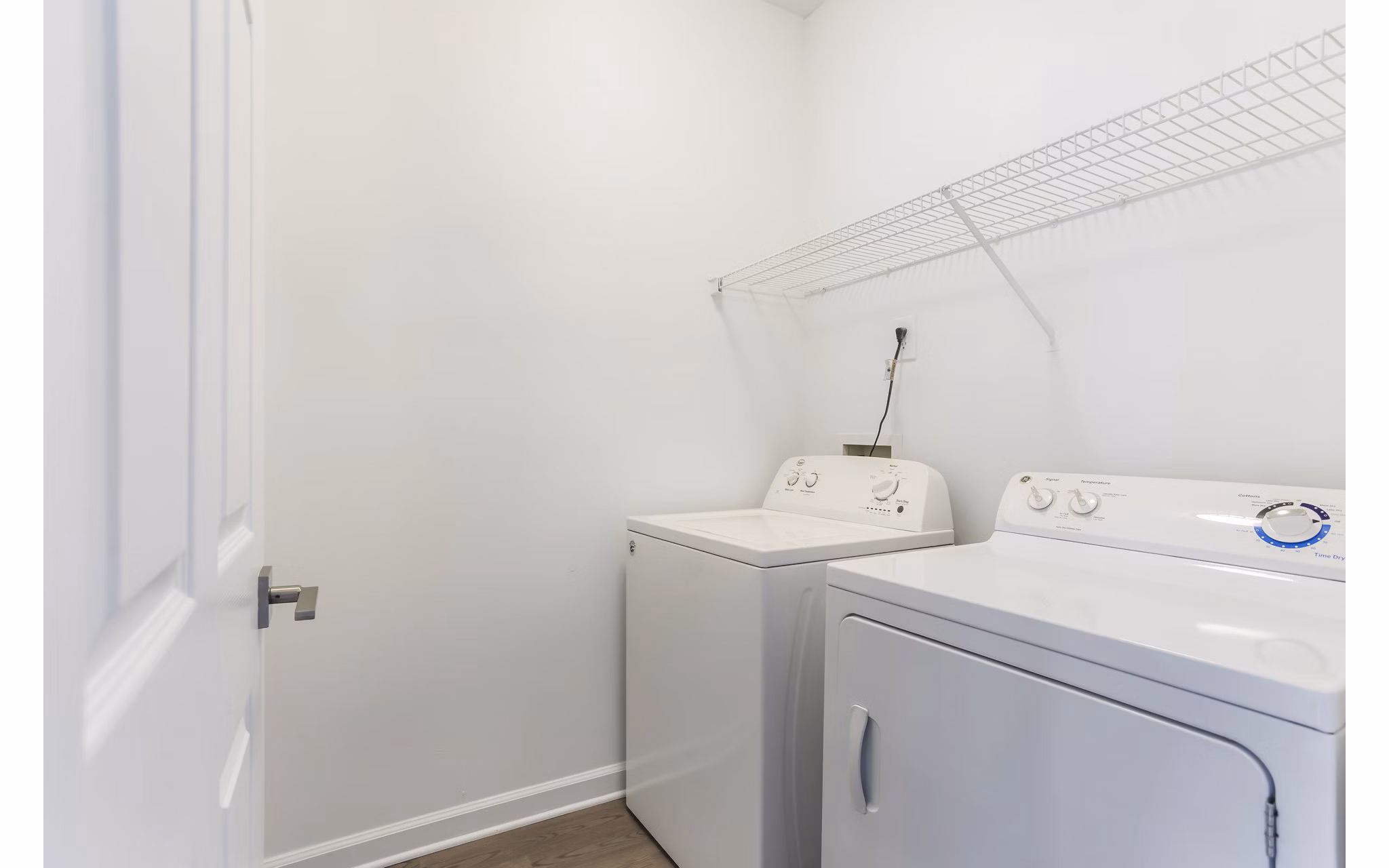 Laundry room with energy-efficient appliances at Ashton Brook Apartments
