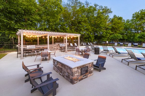Fire pit and patio area at Ashton Brook Apartments offering outdoor relaxation and socializing space