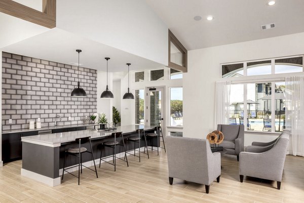 Clubhouse with modern seating and entertainment area at Prose Cartersville Apartments
