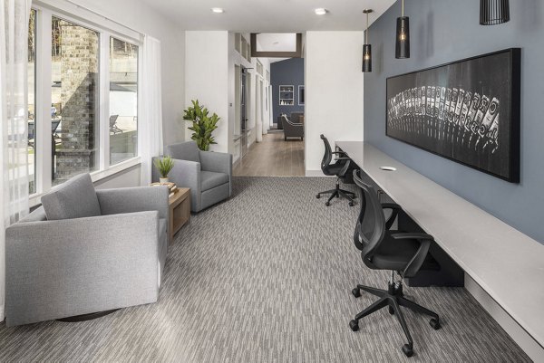 Business center featuring modern workstations and meeting areas at Prose Cartersville Apartments