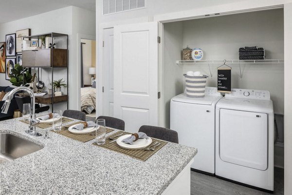 Laundry room featuring modern appliances at Prose Cartersville Apartments