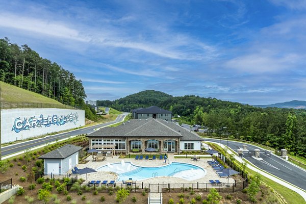 Resort-style pool with sun loungers at Prose Cartersville Apartments