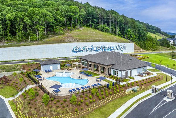 Rooftop pool with sun loungers at Prose Cartersville Apartmentsâ€‹