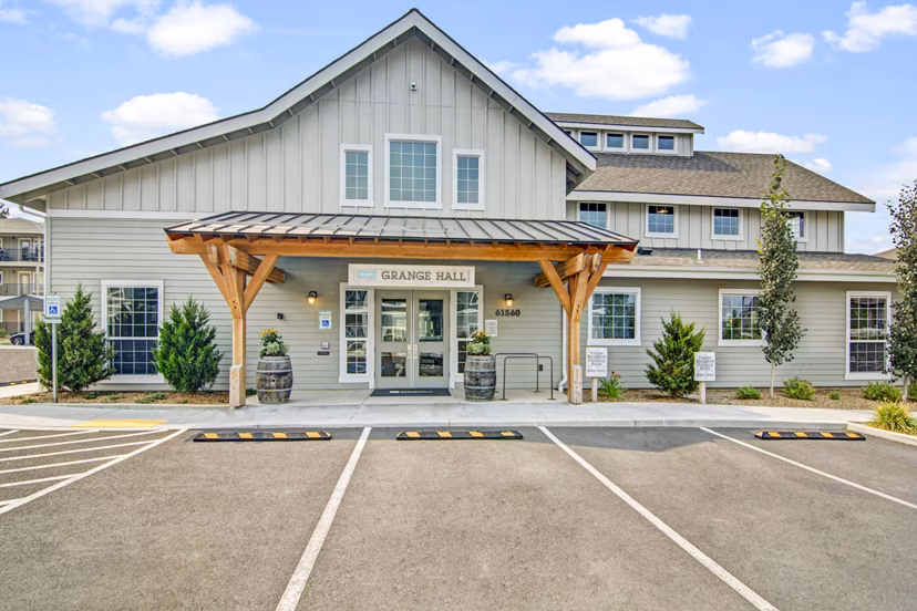 Clubhouse at Seasons at Farmington Reserve Apartments: Modern design with cozy seating and entertainment area