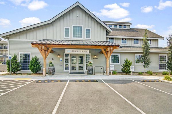 Clubhouse at Seasons at Farmington Reserve Apartments: Modern design with cozy seating and entertainment area