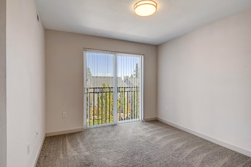 Living room featuring cozy seating and modern decor at Seasons at Farmington Reserve Apartments