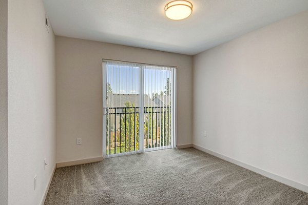 living room at Seasons at Farmington Reserve Apartments