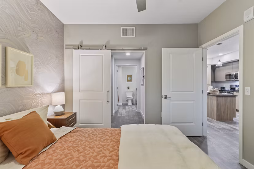 Elegant bedroom featuring modern decor and large windows at Jefferson La Mesa Apartments, Greystar luxury apartments in La Mesa