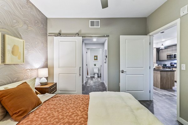 Elegant bedroom featuring modern decor and large windows at Jefferson La Mesa Apartments, Greystar luxury apartments in La Mesa