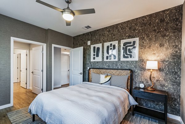 Spacious bedroom with modern decor at Jefferson La Mesa Apartments, featuring luxury amenities for comfortable living