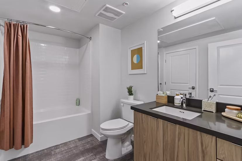 Modern bathroom with double vanity and sleek fixtures at Jefferson La Mesa Apartments