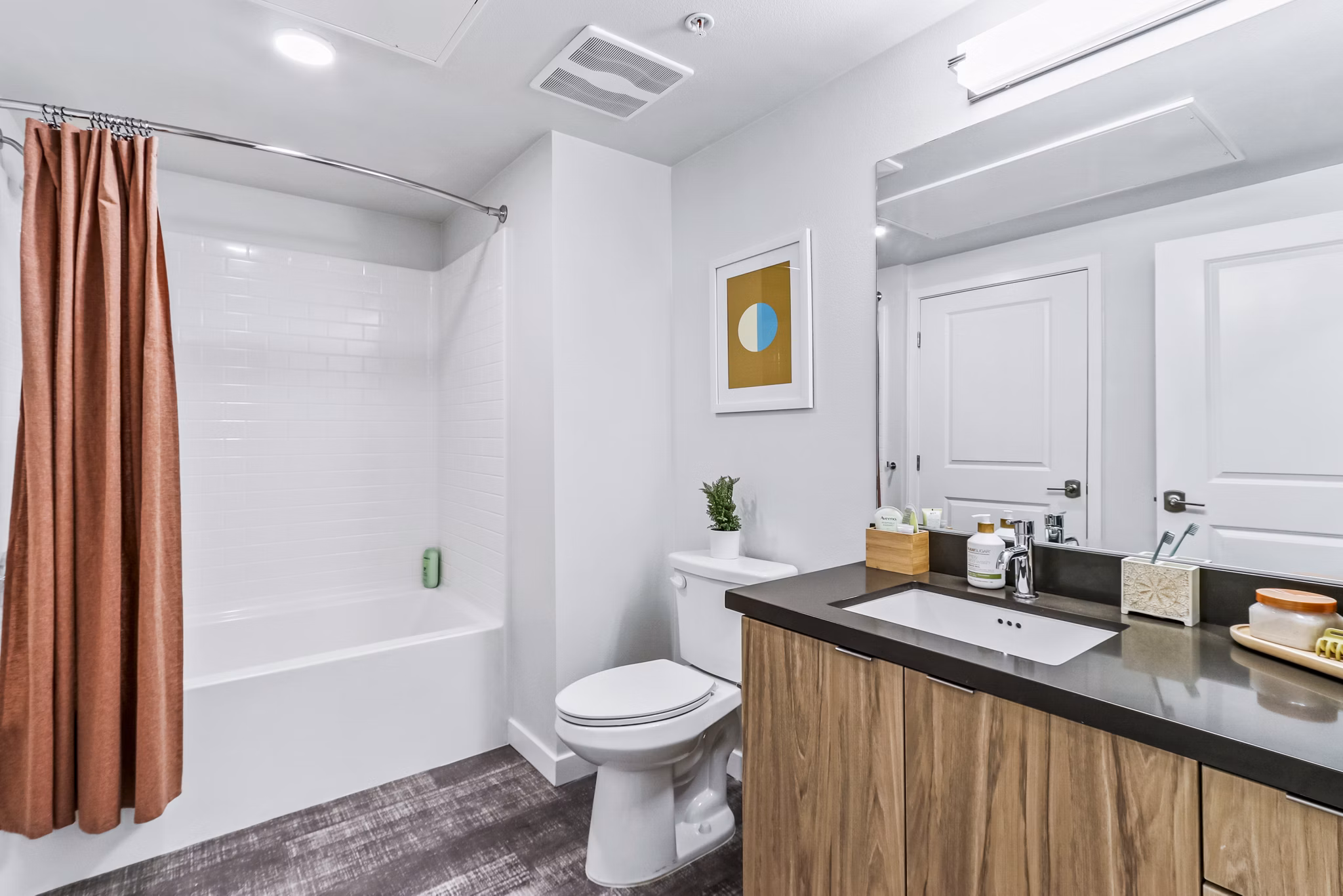 Modern bathroom with double vanity and sleek fixtures at Jefferson La Mesa Apartments