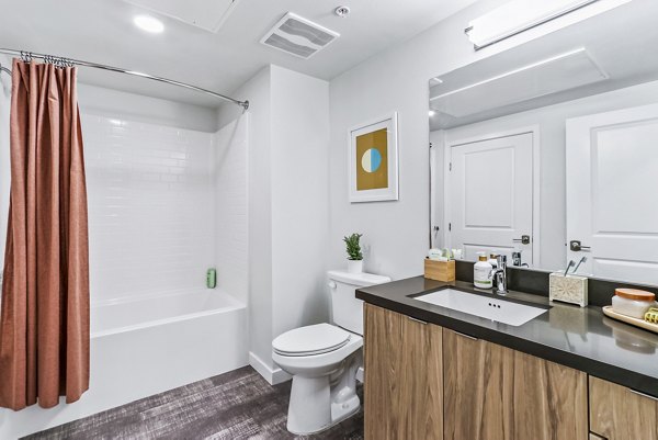 Modern bathroom with double vanity and sleek fixtures at Jefferson La Mesa Apartments