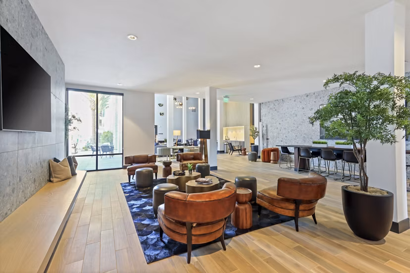 Clubhouse featuring modern decor and seating areas at Jefferson La Mesa Apartments, a luxury apartment community by Greystar