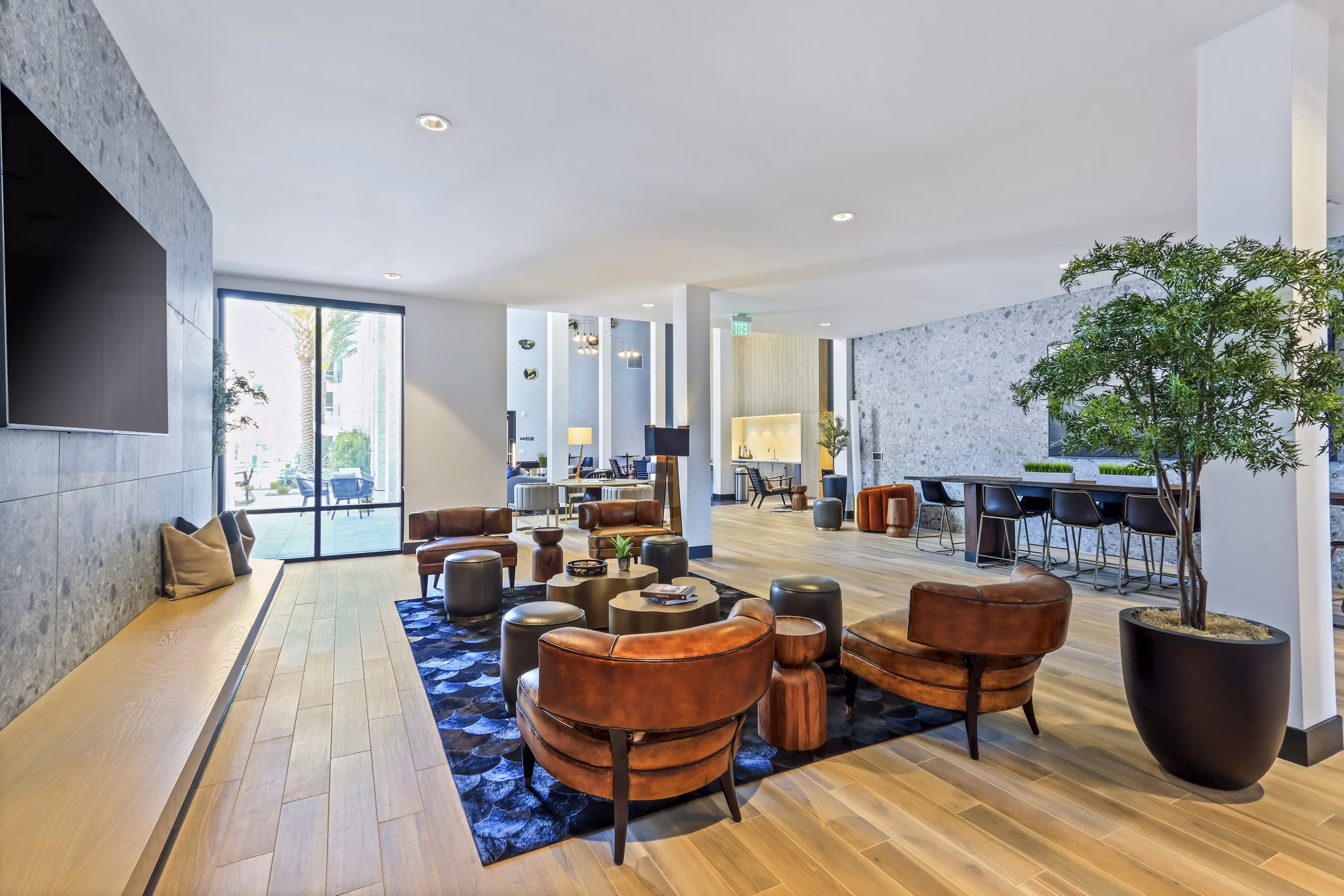 Clubhouse featuring modern decor and seating areas at Jefferson La Mesa Apartments, a luxury apartment community by Greystar