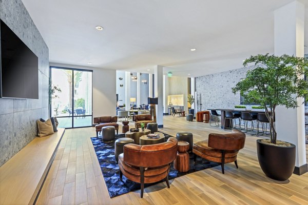 Clubhouse featuring modern decor and seating areas at Jefferson La Mesa Apartments, a luxury apartment community by Greystar