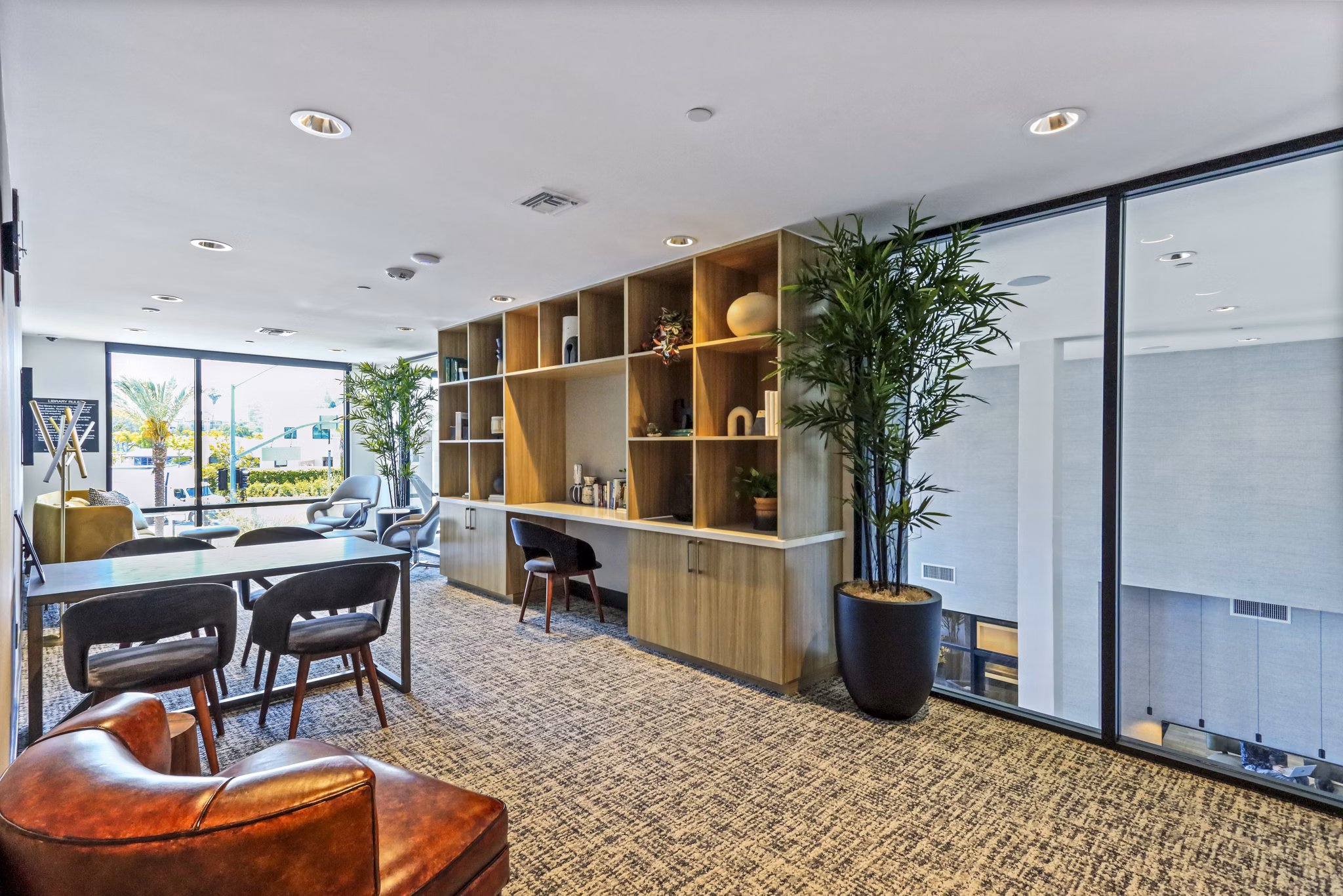 Clubhouse featuring modern design and communal seating at Jefferson La Mesa Apartments
