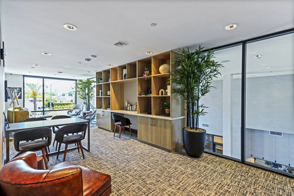 Clubhouse featuring modern design and communal seating at Jefferson La Mesa Apartments