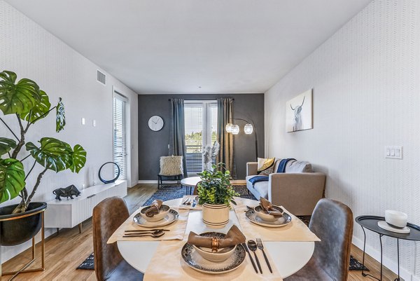 Dining room with elegant lighting and modern furnishings at Jefferson La Mesa Apartments, offering a sophisticated dining experience