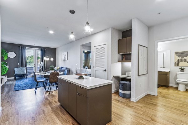 Luxurious kitchen with sleek granite countertops and stainless steel appliances at Jefferson La Mesa Apartments