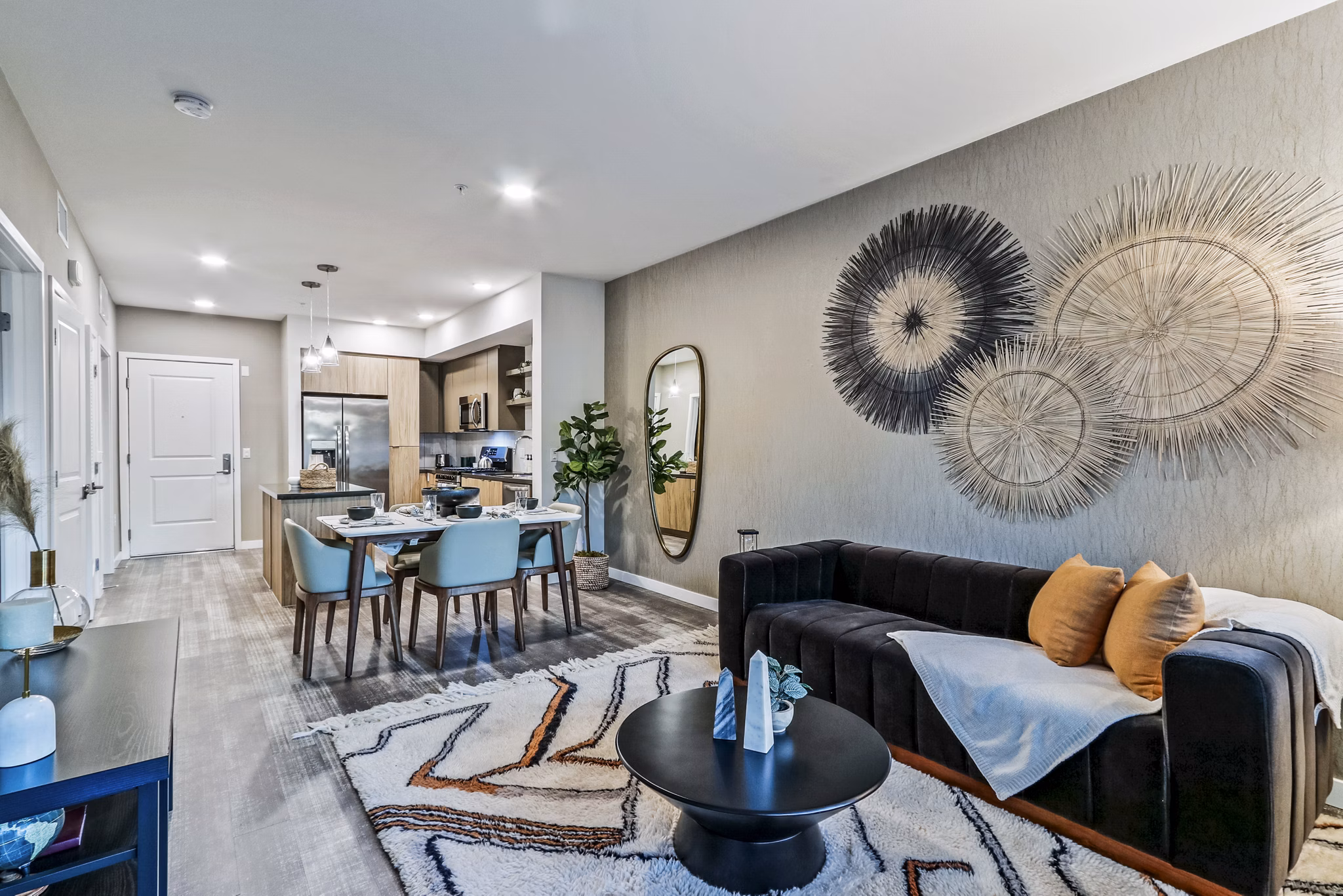 Modern living room with stylish decor at Jefferson La Mesa Apartments, featuring comfortable seating and ambient lighting