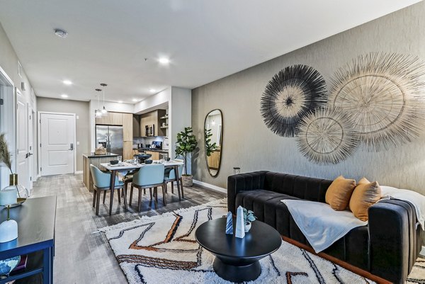Modern living room with stylish decor at Jefferson La Mesa Apartments, featuring comfortable seating and ambient lighting