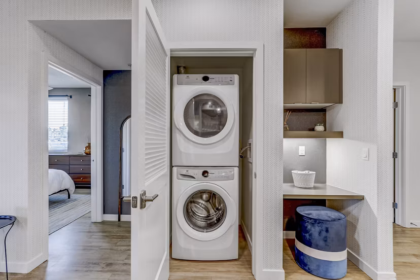Laundry room with modern washers and dryers at Jefferson La Mesa Apartments, offering convenience and efficiency for residents