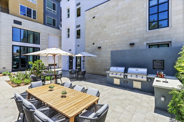 Outdoor grill area and patio at Jefferson La Mesa Apartments offering a perfect spot for gatherings and relaxation