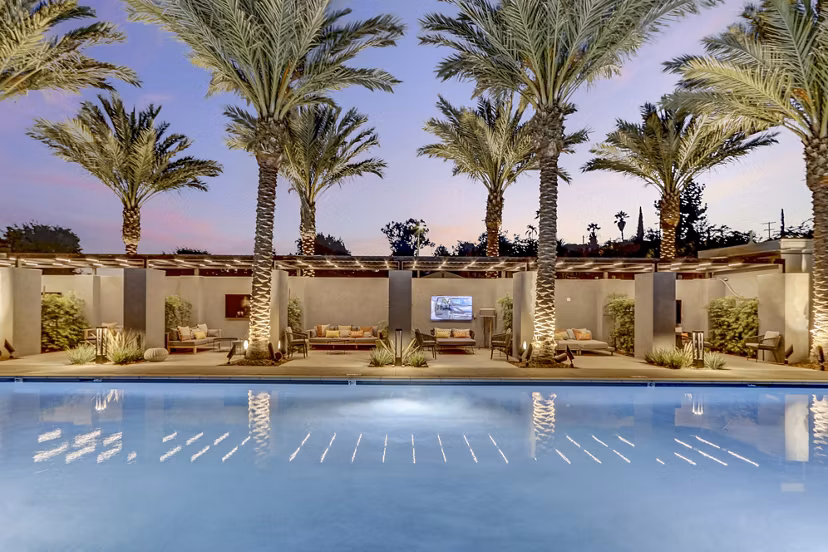 Modern pool with lounge chairs at Jefferson La Mesa Apartments, luxury living in a serene environment