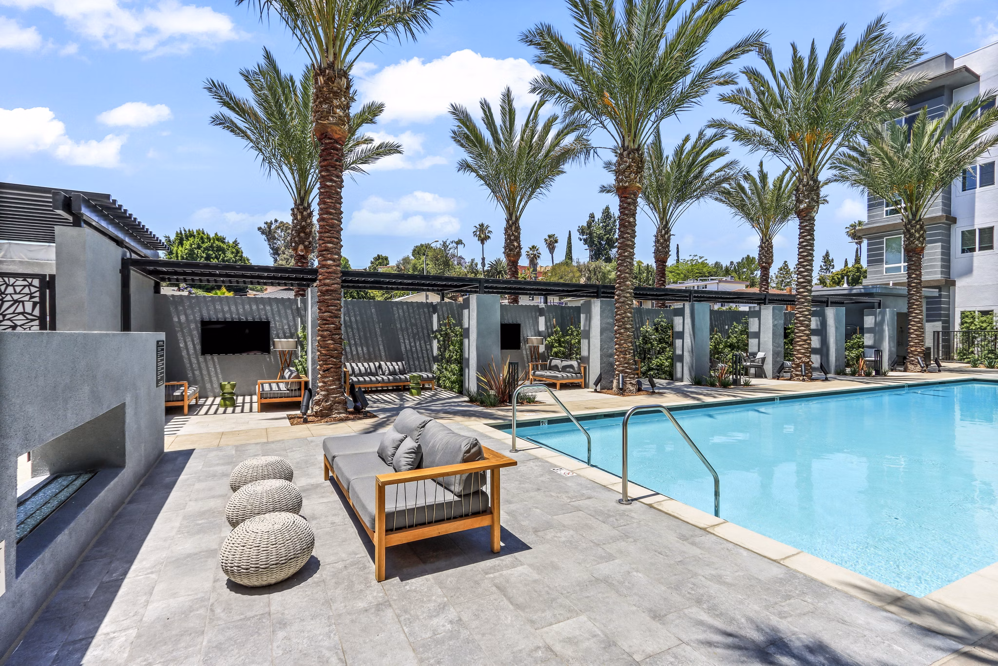 Resort-style pool with lounge chairs at Jefferson La Mesa Apartments, luxury living in a vibrant San Diego community