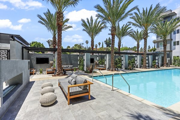 Resort-style pool with lounge chairs at Jefferson La Mesa Apartments, luxury living in a vibrant San Diego community