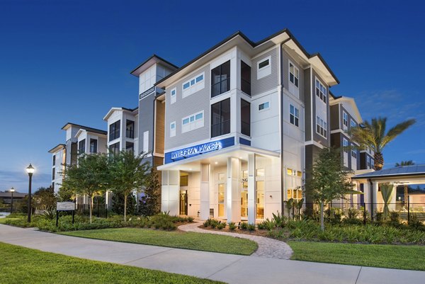 Resort-style pool with lounge areas at Integra Lakes Apartments