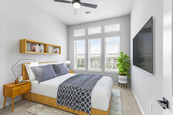 Cozy bedroom with stylish decor at The Ludlow Apartments