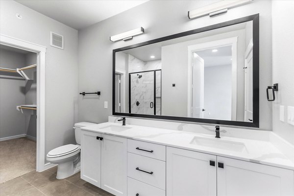 Modern bathroom featuring sleek fixtures at The Ludlow Apartments