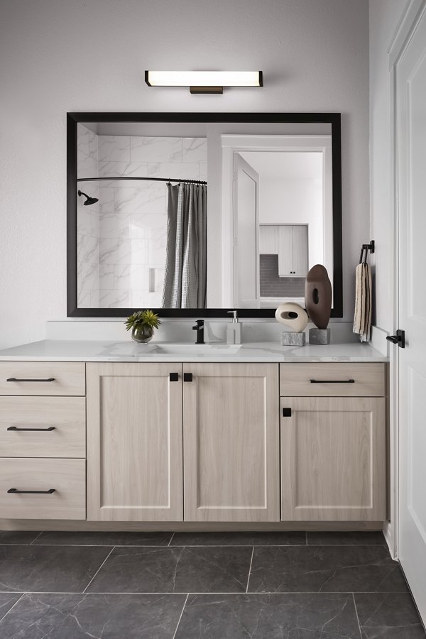 Modern bathroom with marble countertops at The Ludlow Apartments featuring luxury finishes in NYC