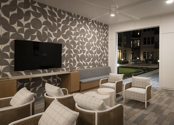 Contemporary clubhouse with modern dÃ©cor at The Ludlow Apartments featuring gathering spaces and game rooms