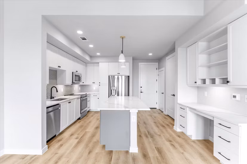Modern kitchen with stainless steel appliances at The Ludlow Apartments, a luxurious living space