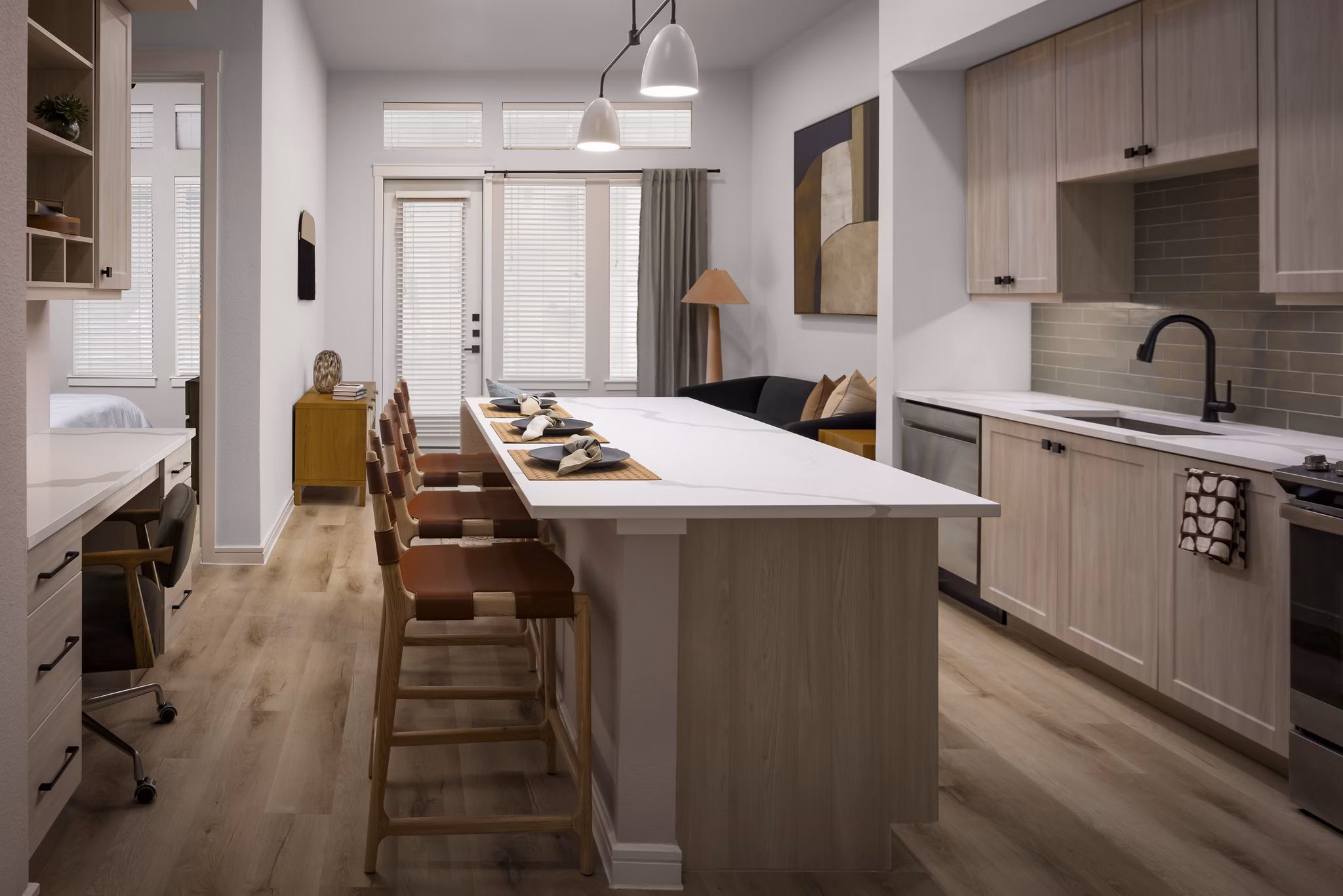 Modern kitchen with stainless steel appliances at The Ludlow Apartments