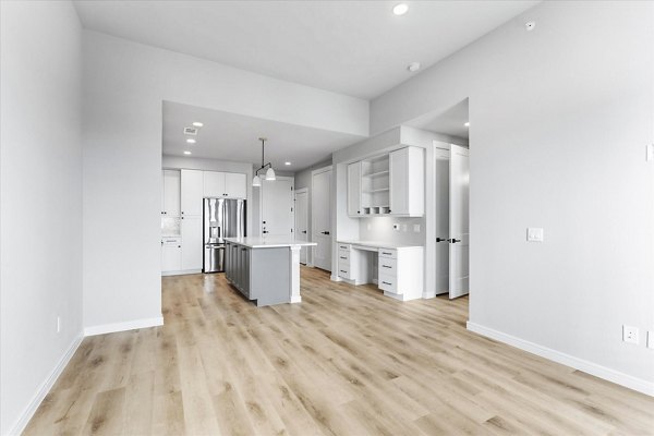 Modern living room with sleek furnishings and vibrant decor in The Ludlow Apartments, luxury apartments in lively city setting