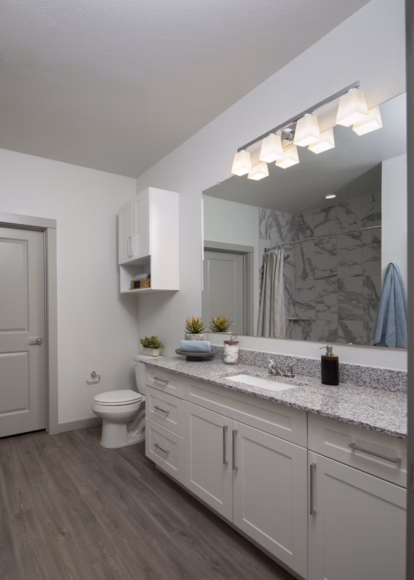 Bathroom with stylish fixtures and modern lighting at Prose North West Apartments