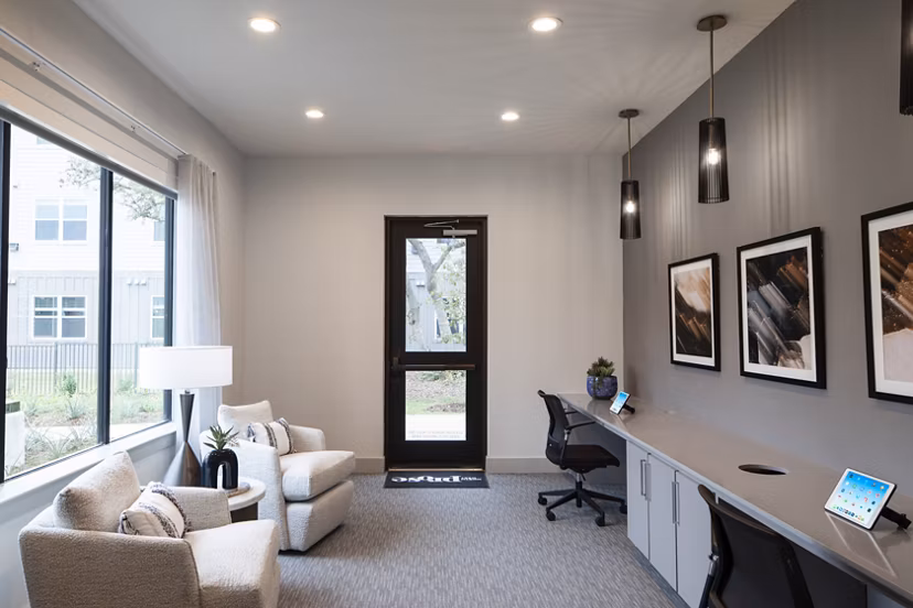 Business center with computer stations at Prose North West Apartments, ideal for remote work and meetings