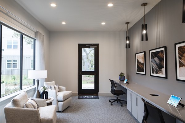 Business center with computer stations at Prose North West Apartments, ideal for remote work and meetings