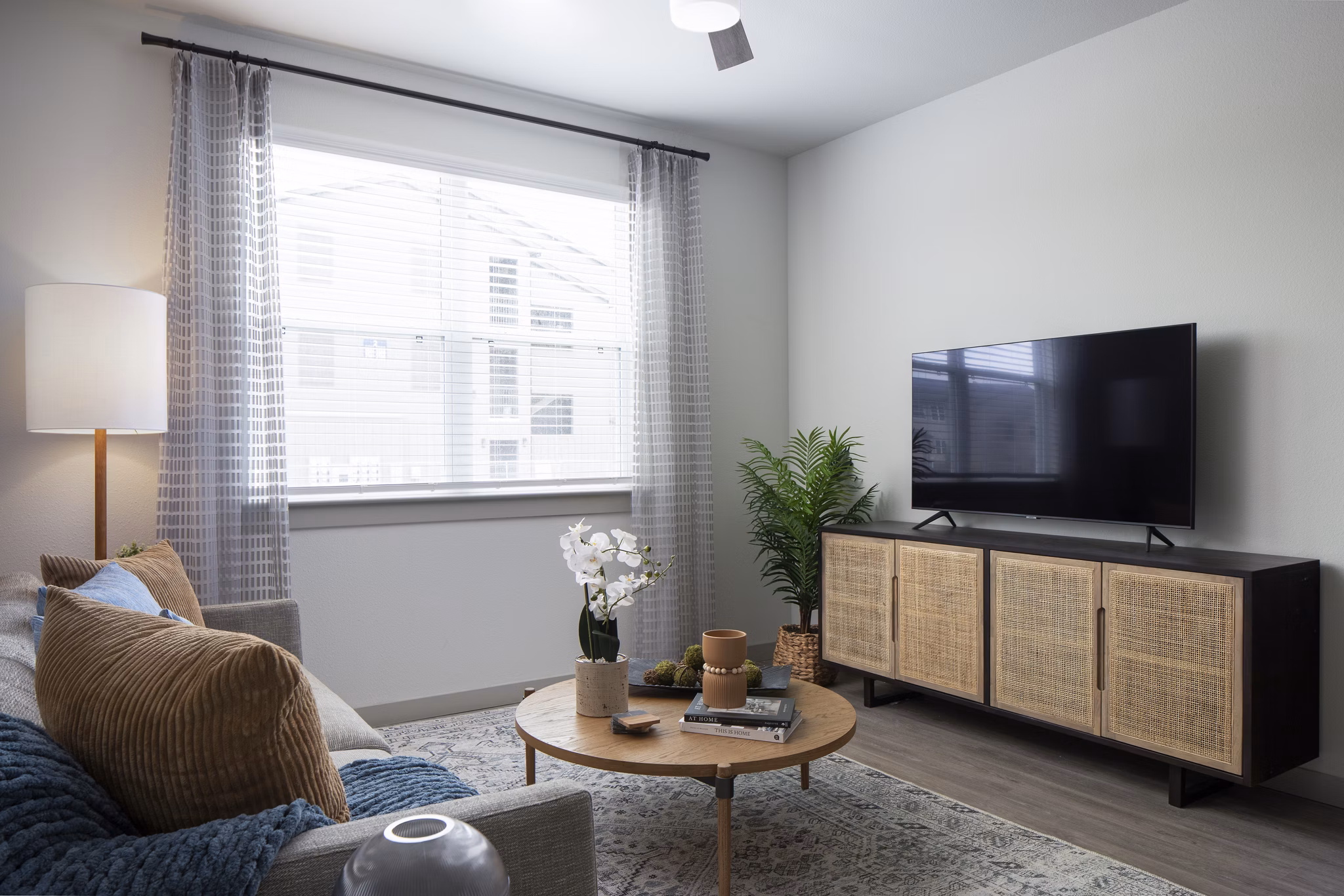 Spacious living room with modern decor in Prose North West Apartments