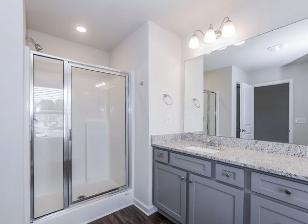 Bathroom featuring modern fixtures and elegant design in Tranquil Gardens Homes