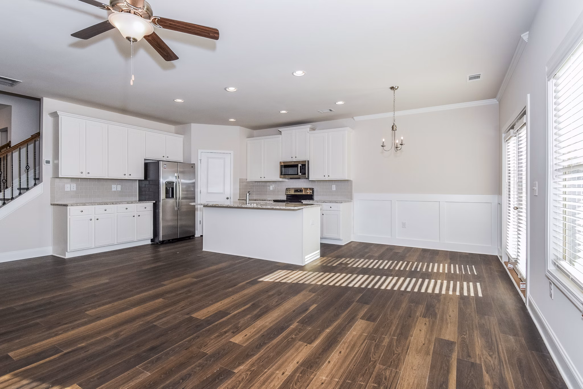 Dining area with elegant table setting and pendant lighting in Tranquil Gardens Apartments